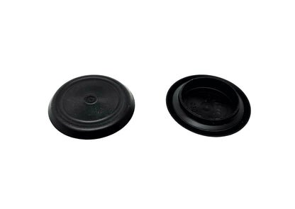 Two black rubber caps on a white background