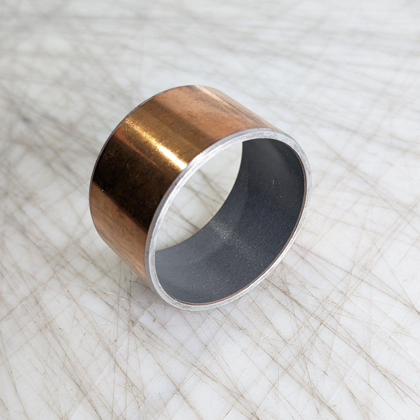 Round brass bushing with Teflon liner
