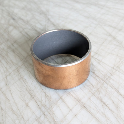 Round brass bushing with Teflon liner